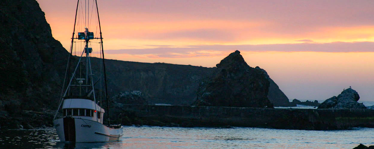 sunset on bay with boat